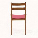 Vintage chairs from the 1950s in wood and faux leather.