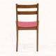 Vintage chairs from the 1950s in wood and faux leather.