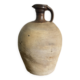 Old handmade stoneware jug – Raw and glazed brown stoneware