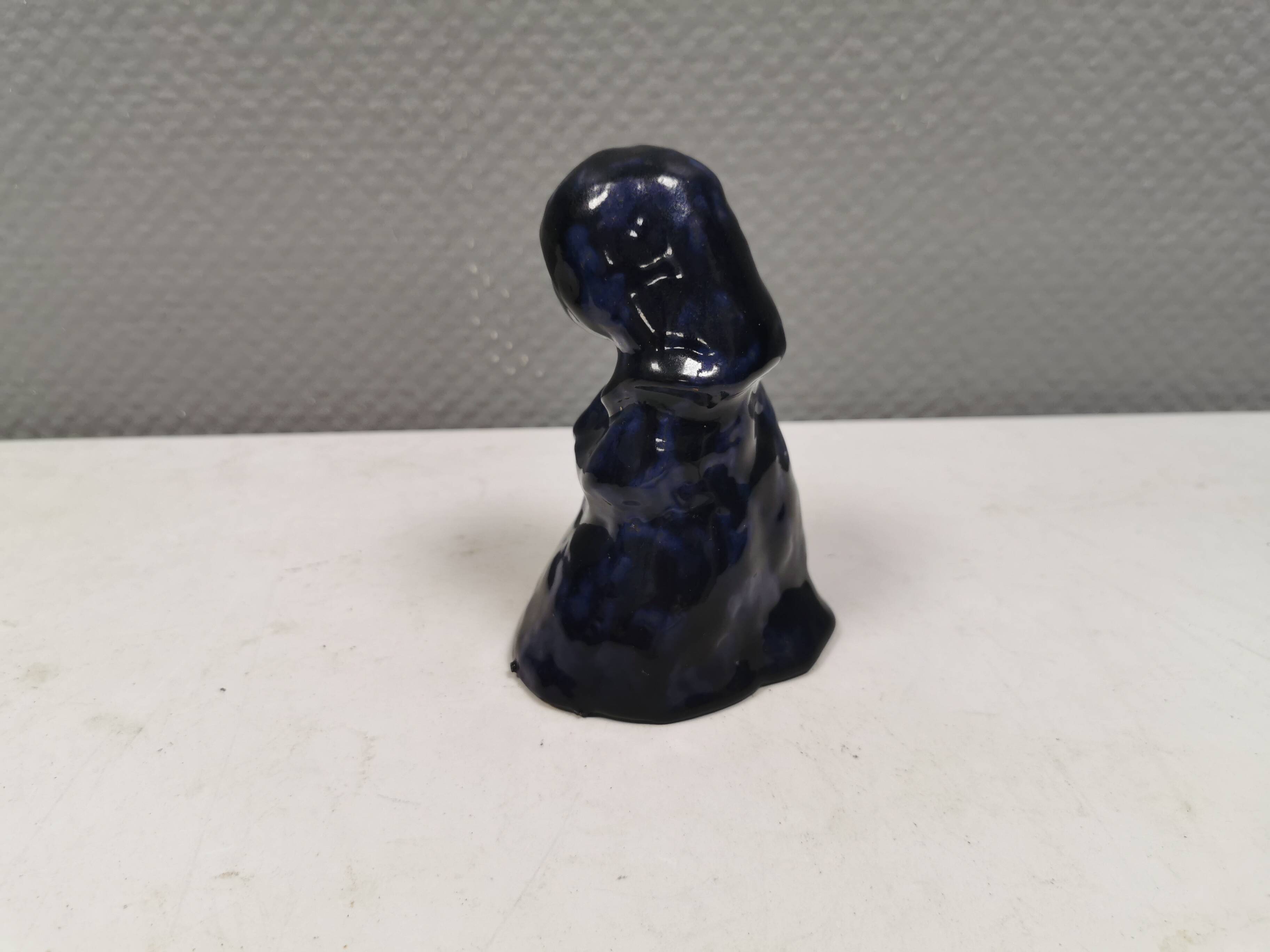 Lady figure in earthenware with shiny blue glaze