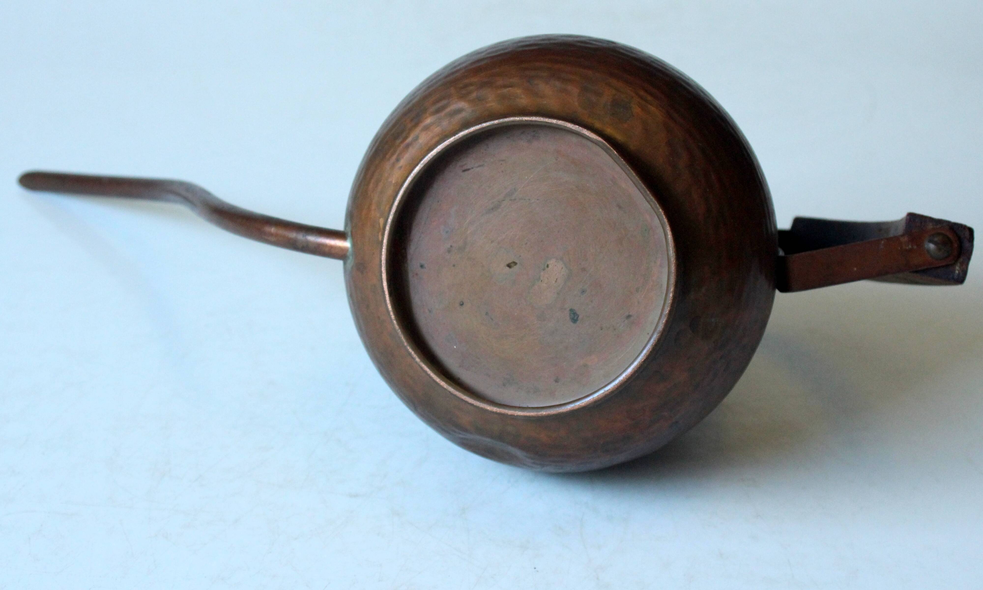 Old copper watering can with wooden handle, complete usuable, vintage from the 1960s