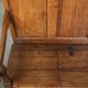 Antique English oak hall bench from the early 19th century with storage space