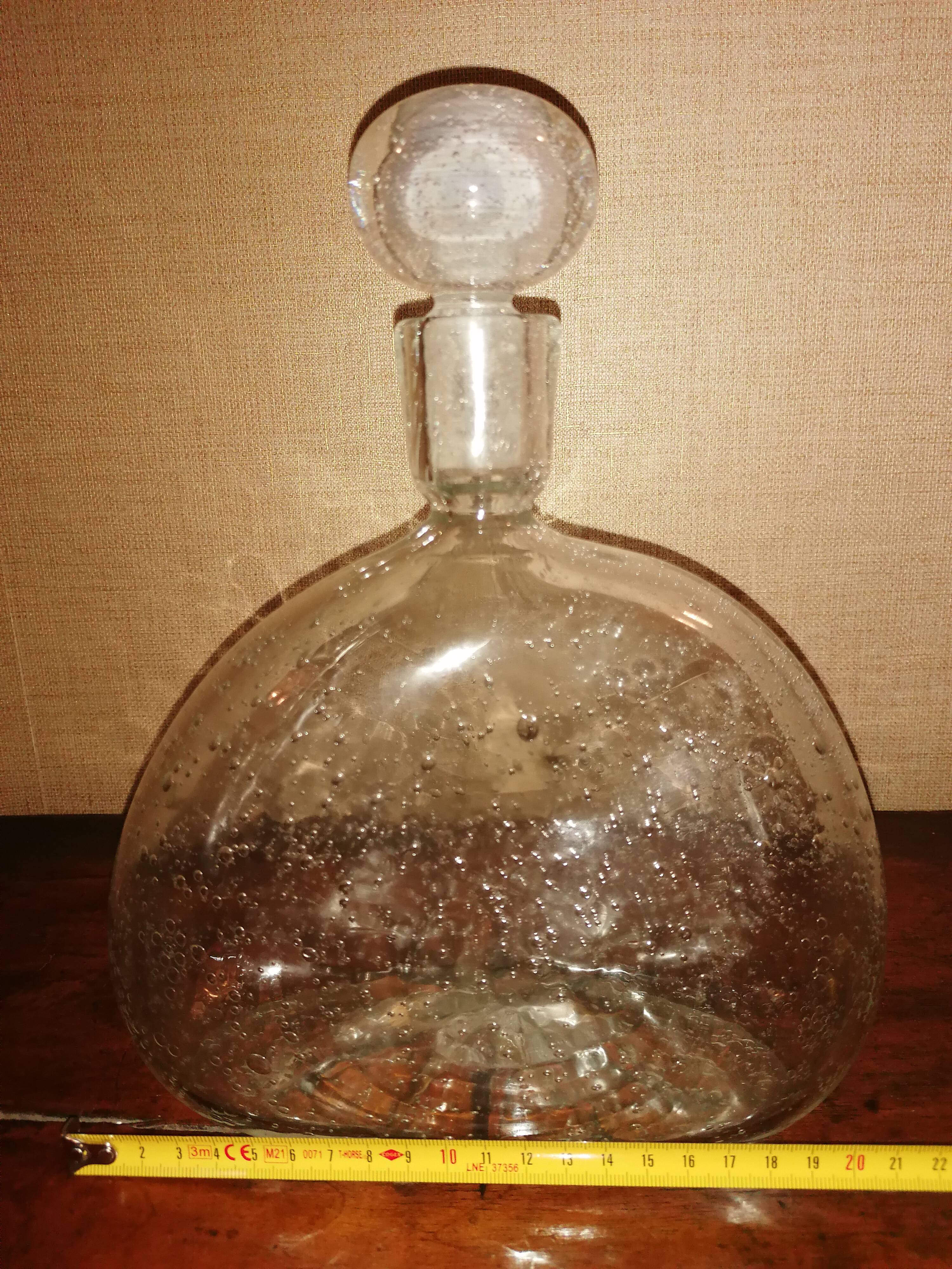 Clear bubble glass bottle molded for easy manual gripping