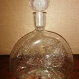 Clear bubble glass bottle molded for easy manual gripping