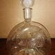 Clear bubble glass bottle molded for easy manual gripping