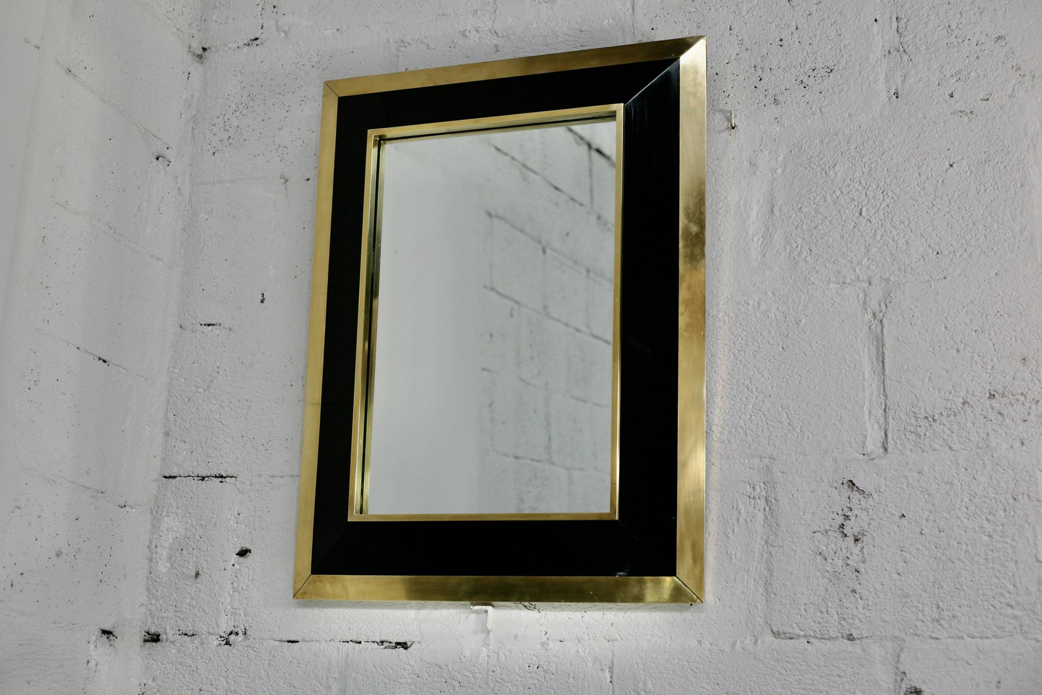 Jean-Claude Mahey mirror. Black lacquered wood and gold metal. 1970