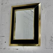 Jean-Claude Mahey mirror. Black lacquered wood and gold metal. 1970