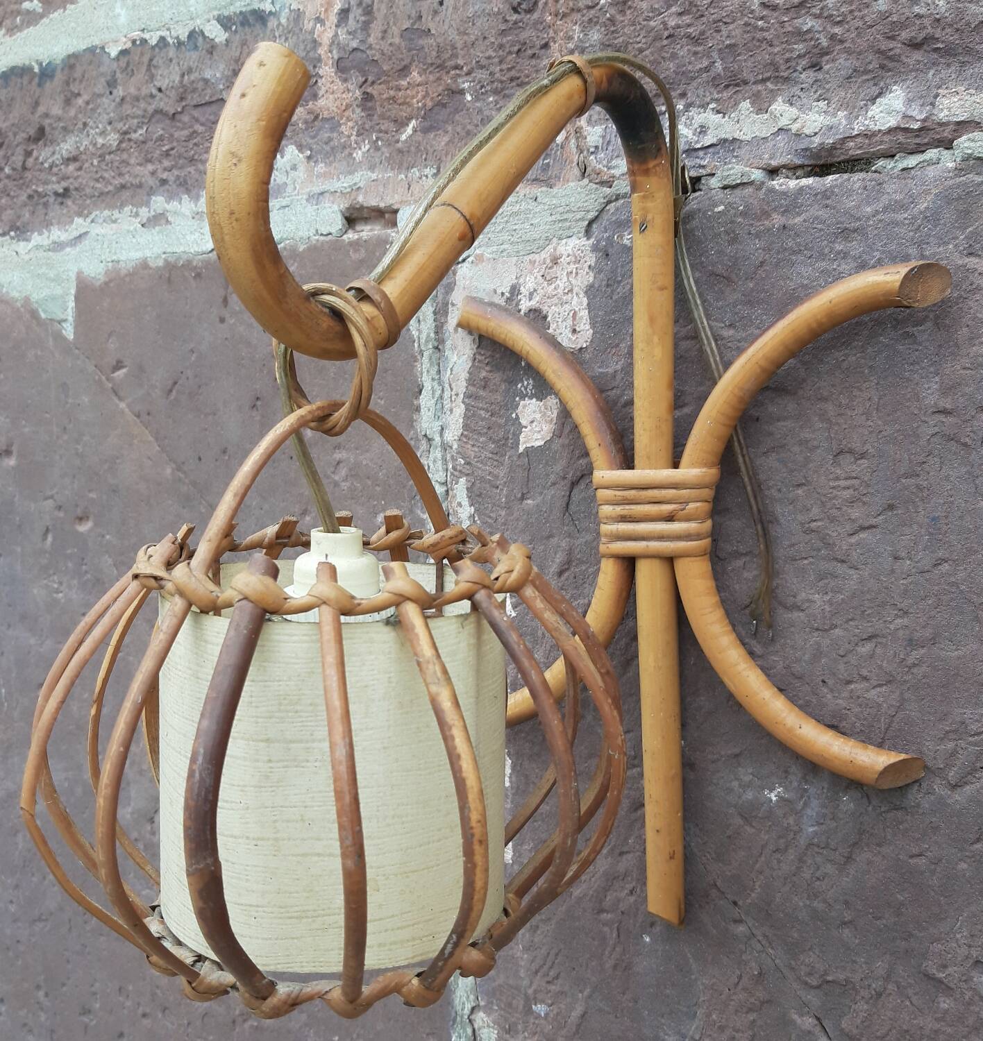 Pair of Louis Sognot rattan wall lights.