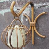 Pair of Louis Sognot rattan wall lights.