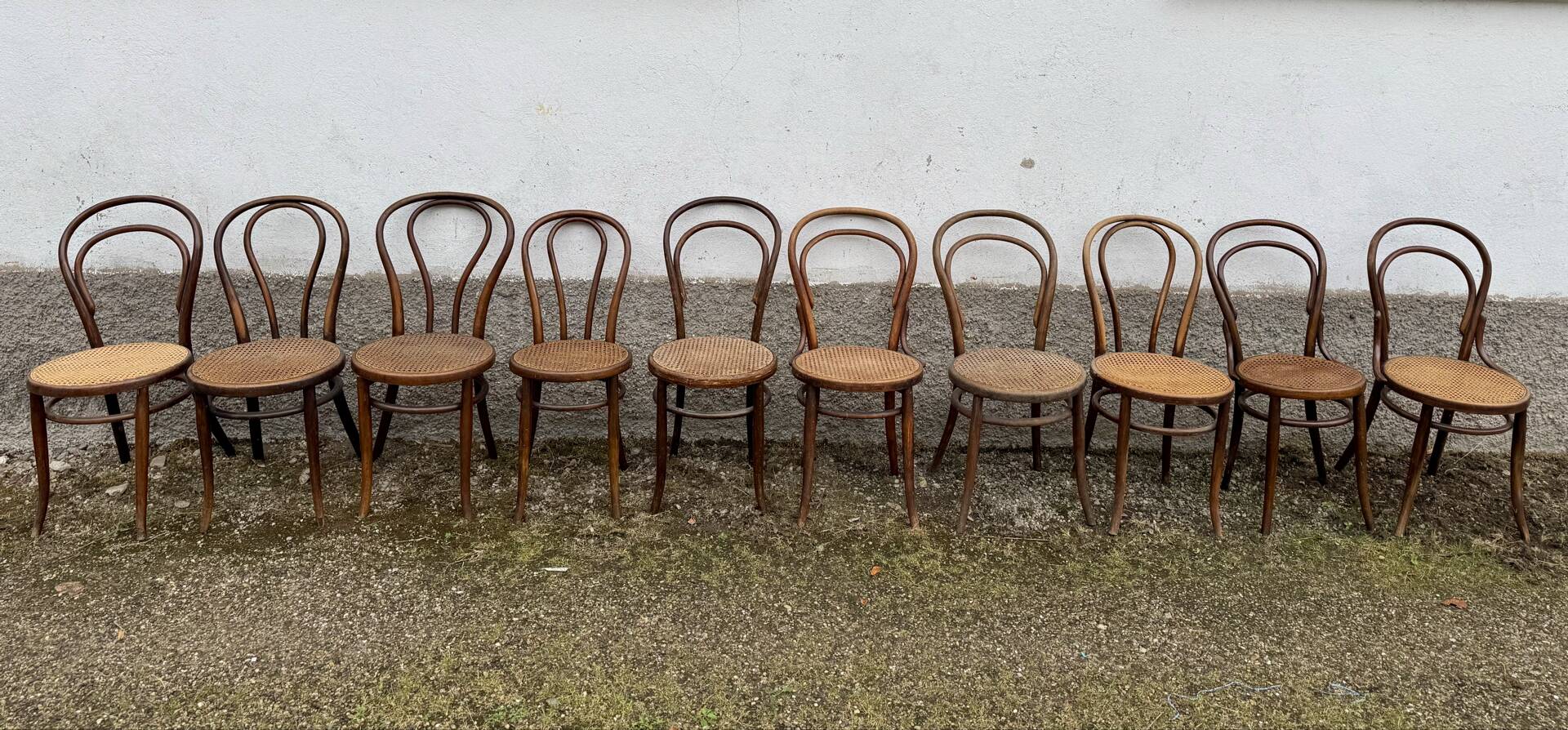 Set of 10 bentwood bistro chairs with cane seat.