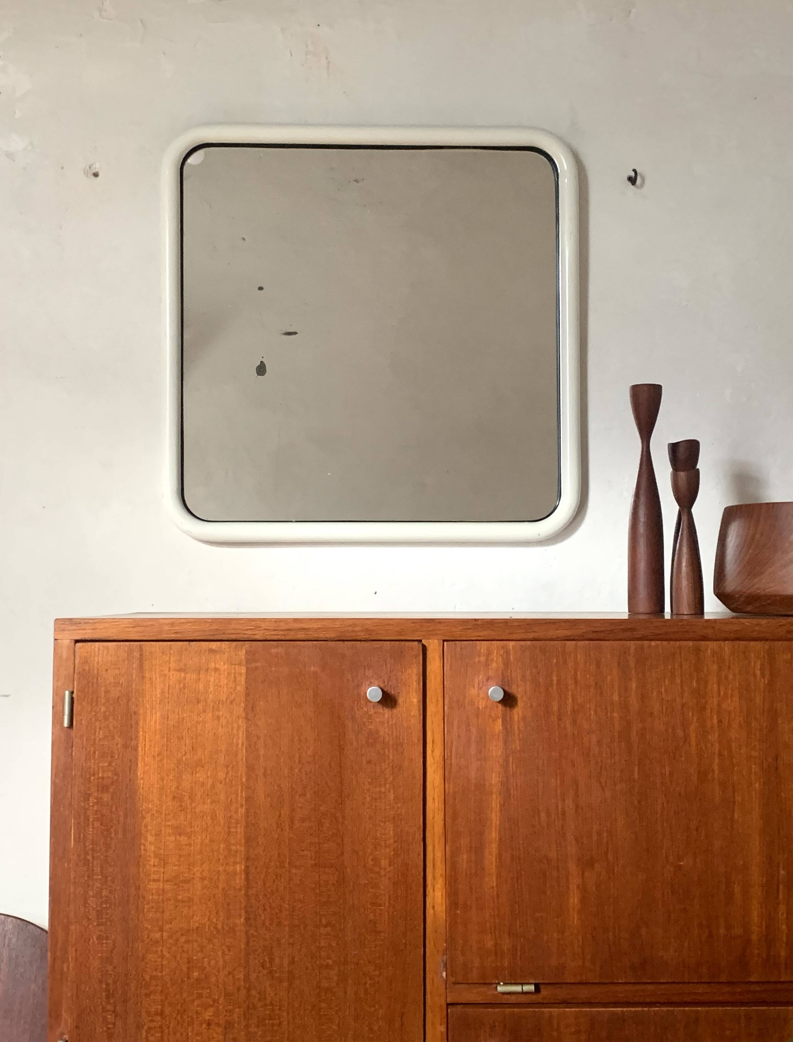 White tubular metal wall mirror