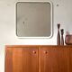 White tubular metal wall mirror