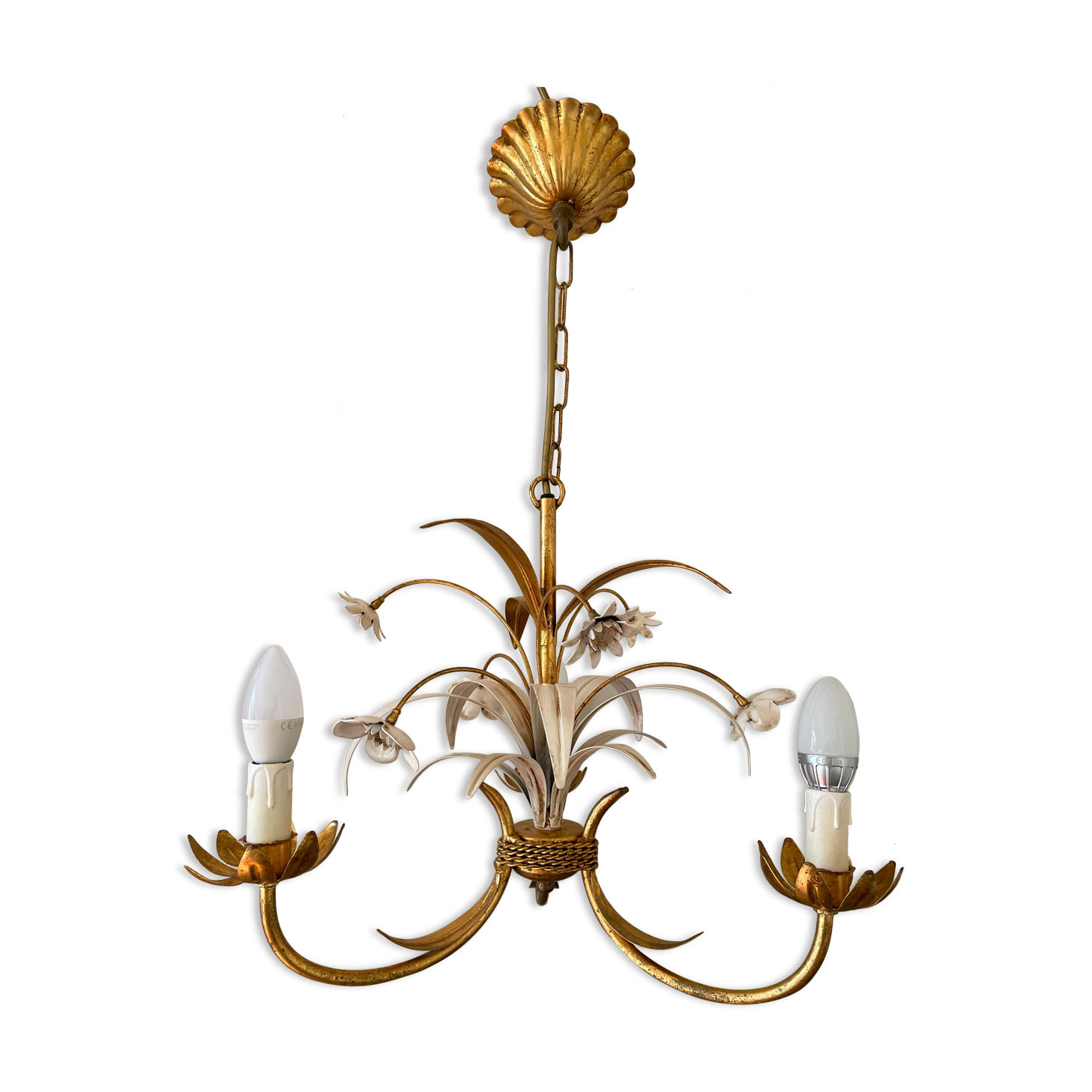 Golden metal chandelier decorated with flowers