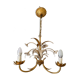Golden metal chandelier decorated with flowers