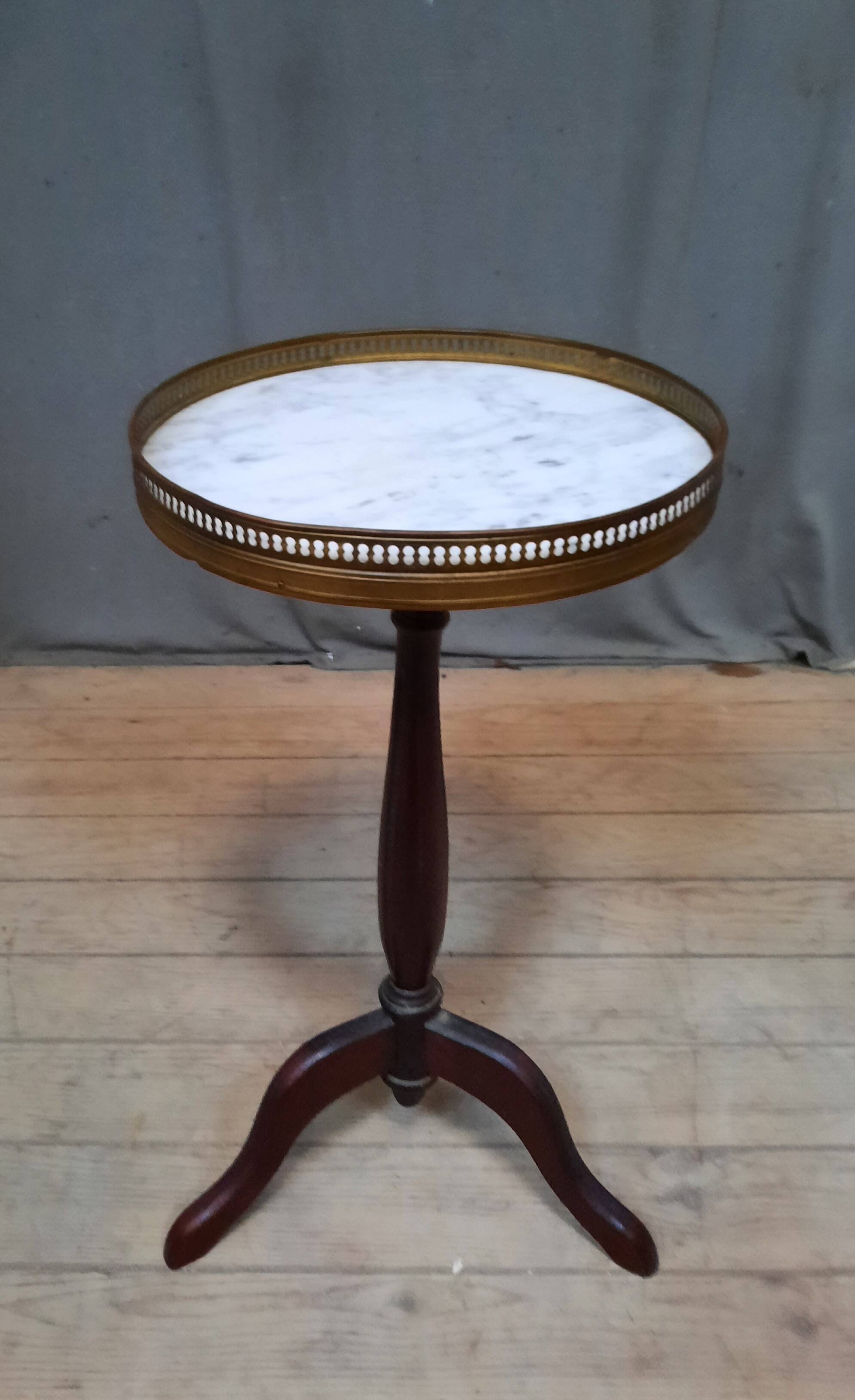 Small marble top pedestal table