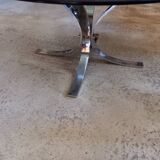 Round coffee table in smoked glass and chrome-plated metal