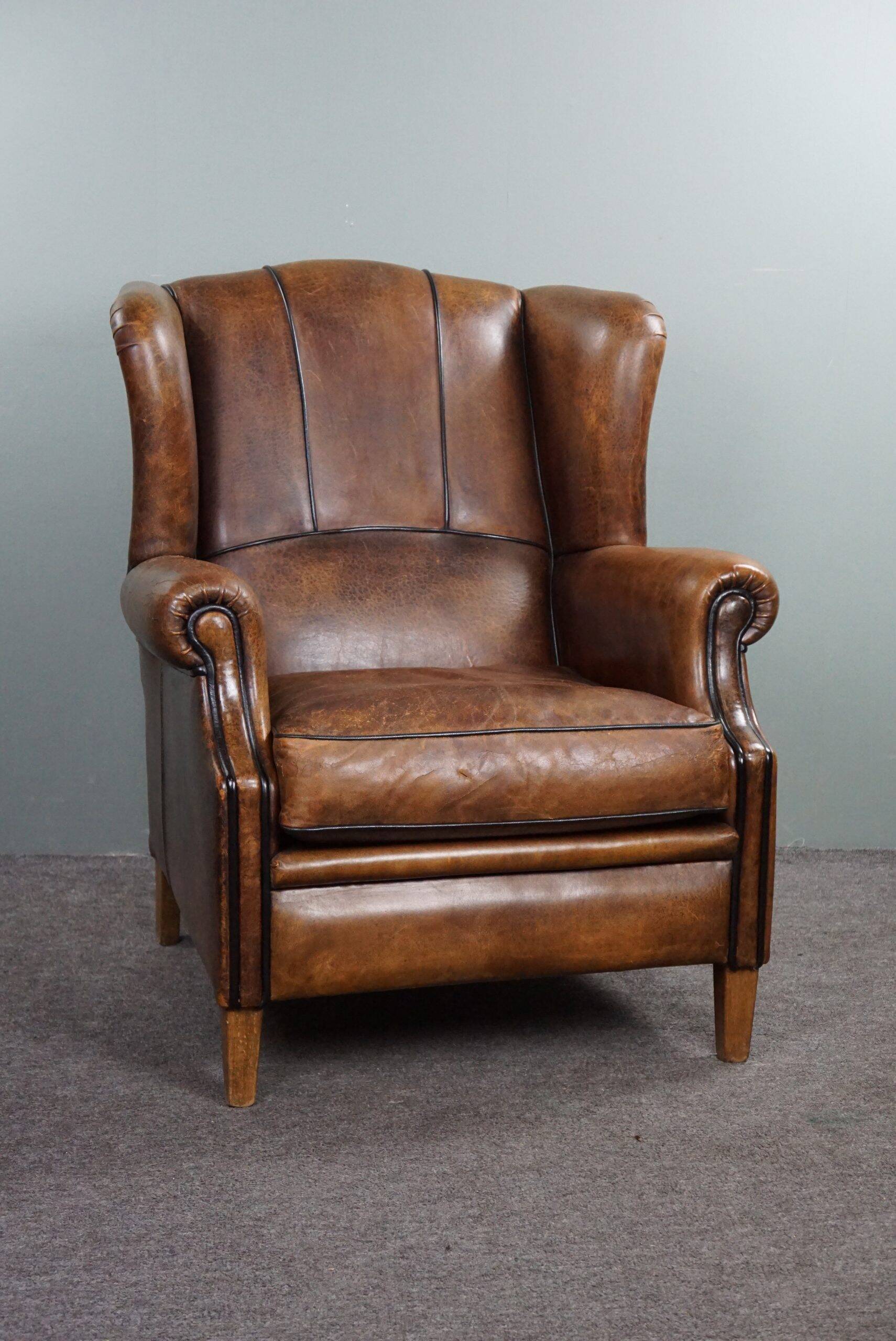 Fauteuil à oreilles en cuir de mouton