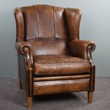 Fauteuil à oreilles en cuir de mouton