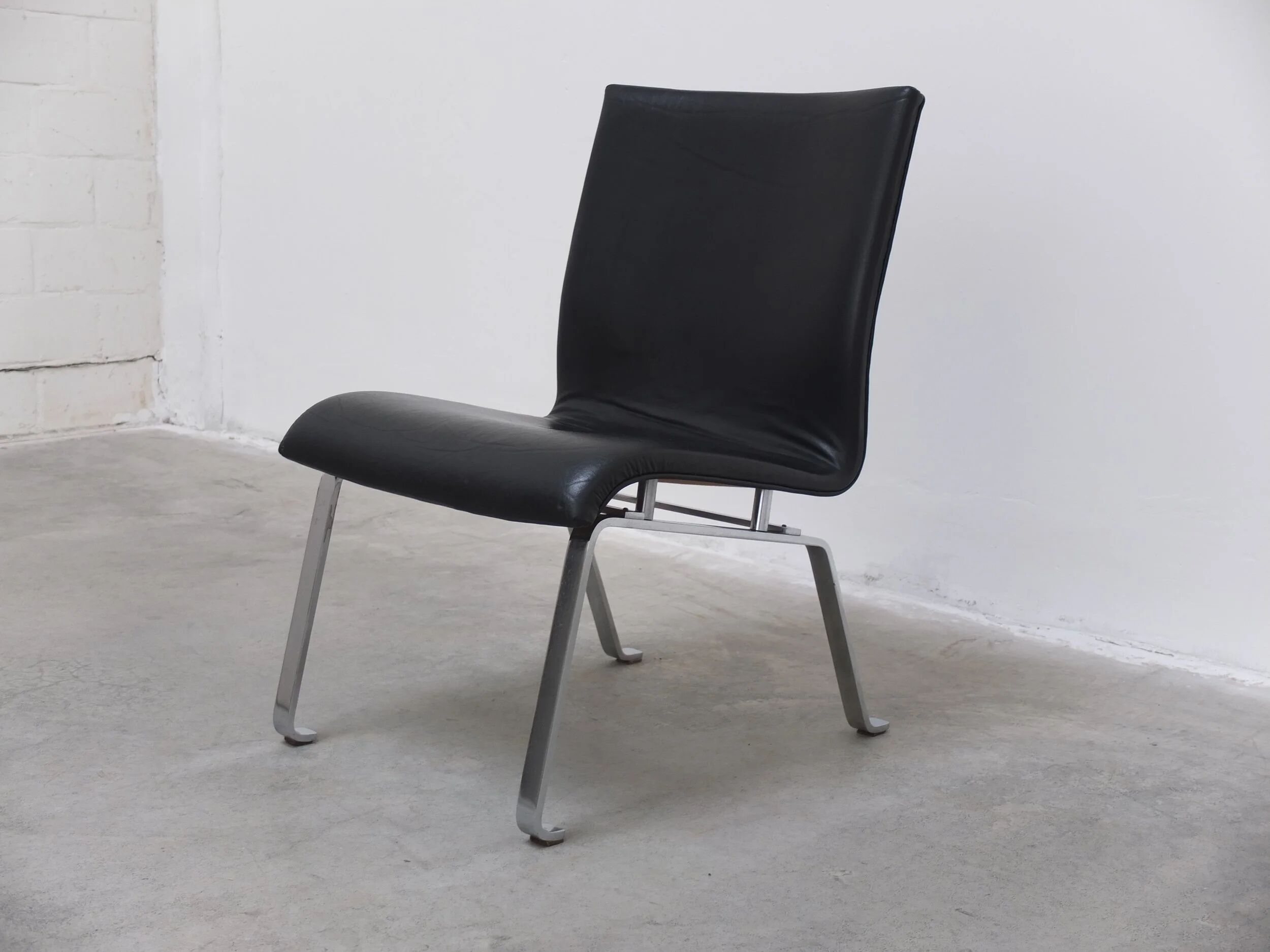 Unique black leather & steel modernist lounge chair, 1960s