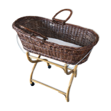 Old woven wicker baby cradle