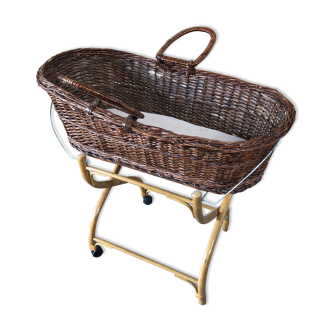 Old woven wicker baby cradle