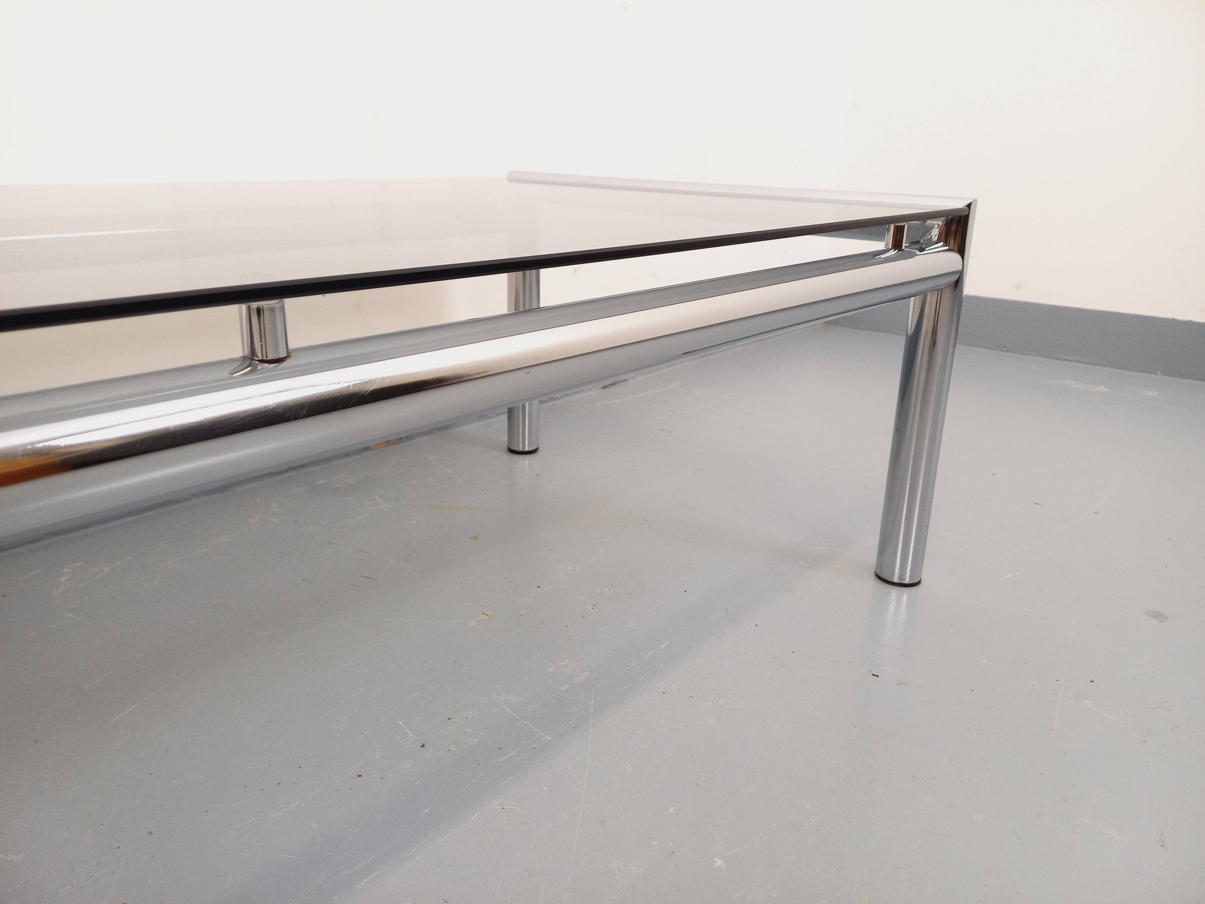 Vintage rectangular coffee table in smoked glass and chrome metal from the 1960s.