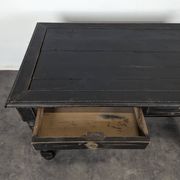 Louis XIII style desk in blackened wood with turned legs and two drawers.