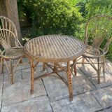 Round table with 2 rattan chairs