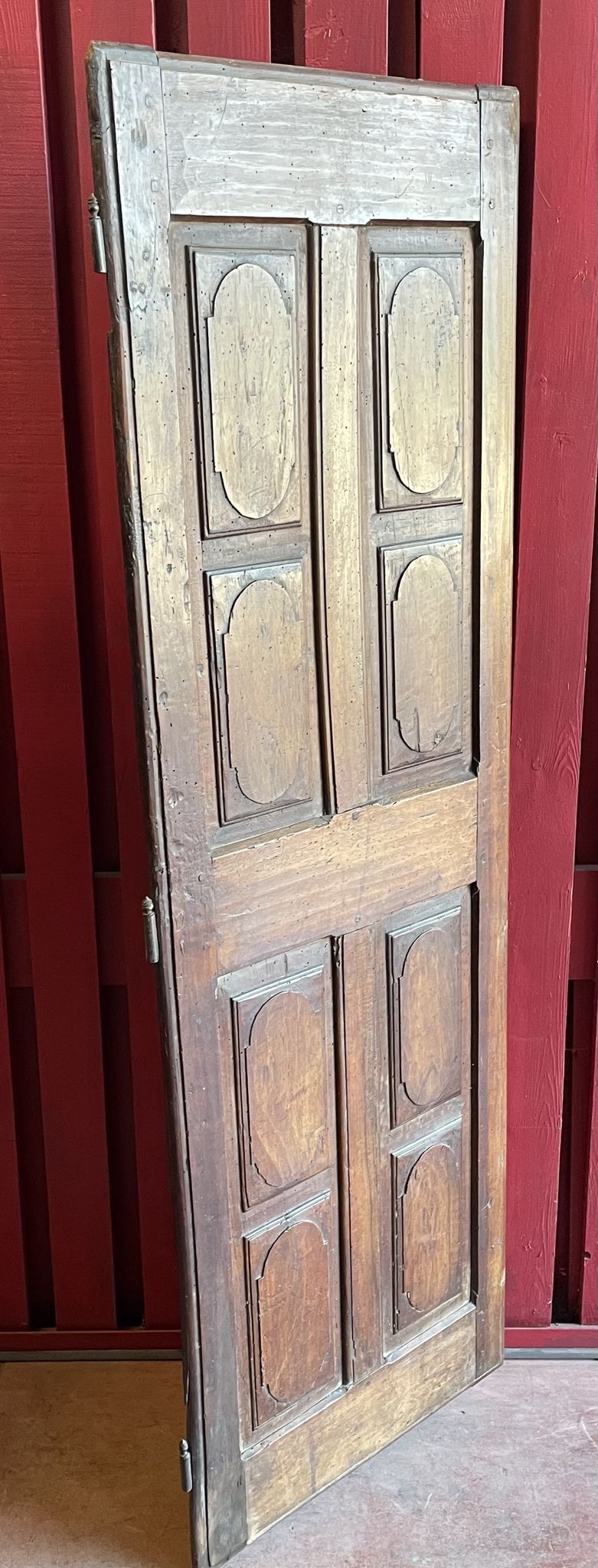 France old 18th century walnut closet door. Composed of 8 finely carved panels.