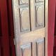 France old 18th century walnut closet door. Composed of 8 finely carved panels.