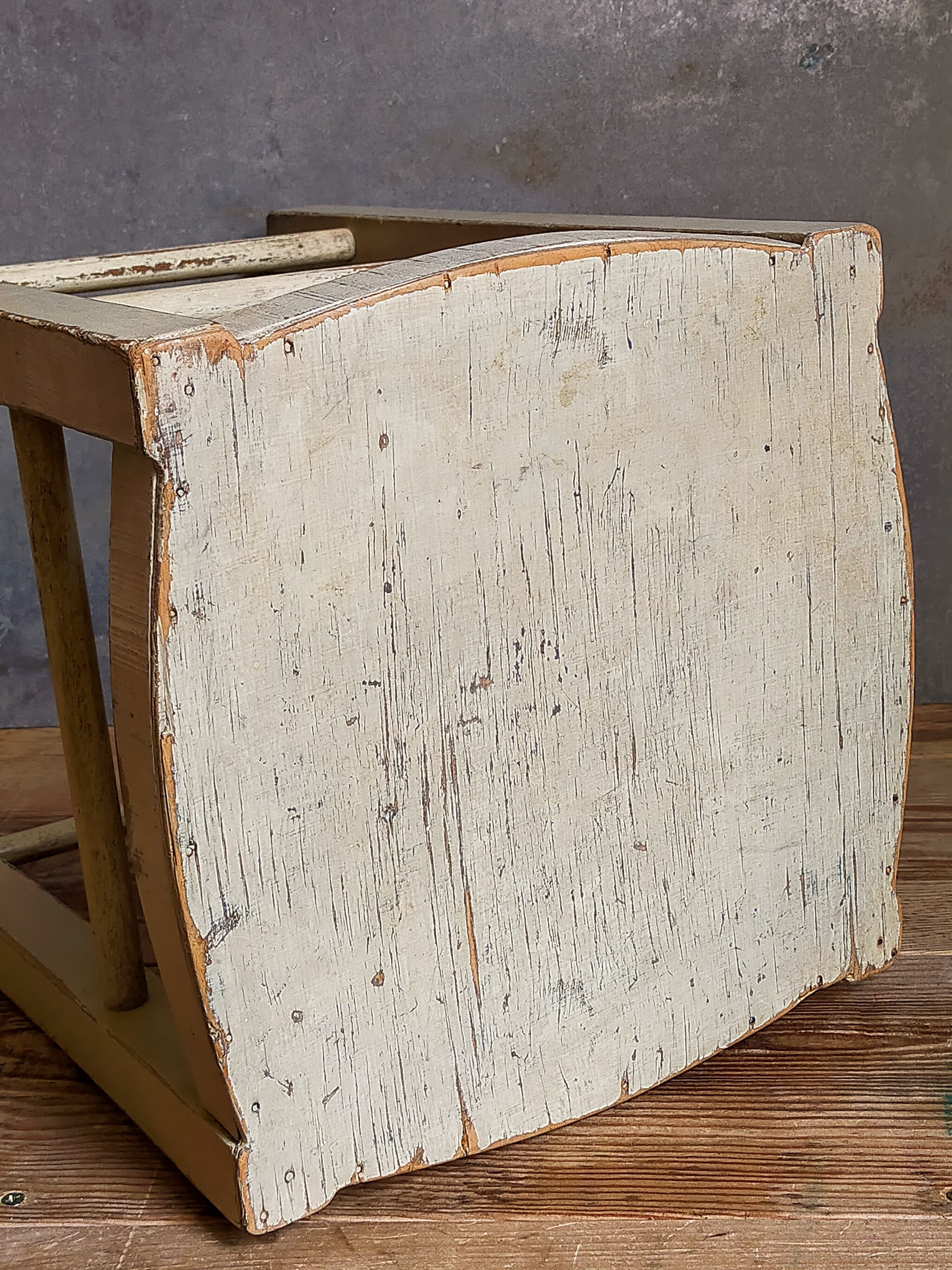 Old patinated painted wooden stool