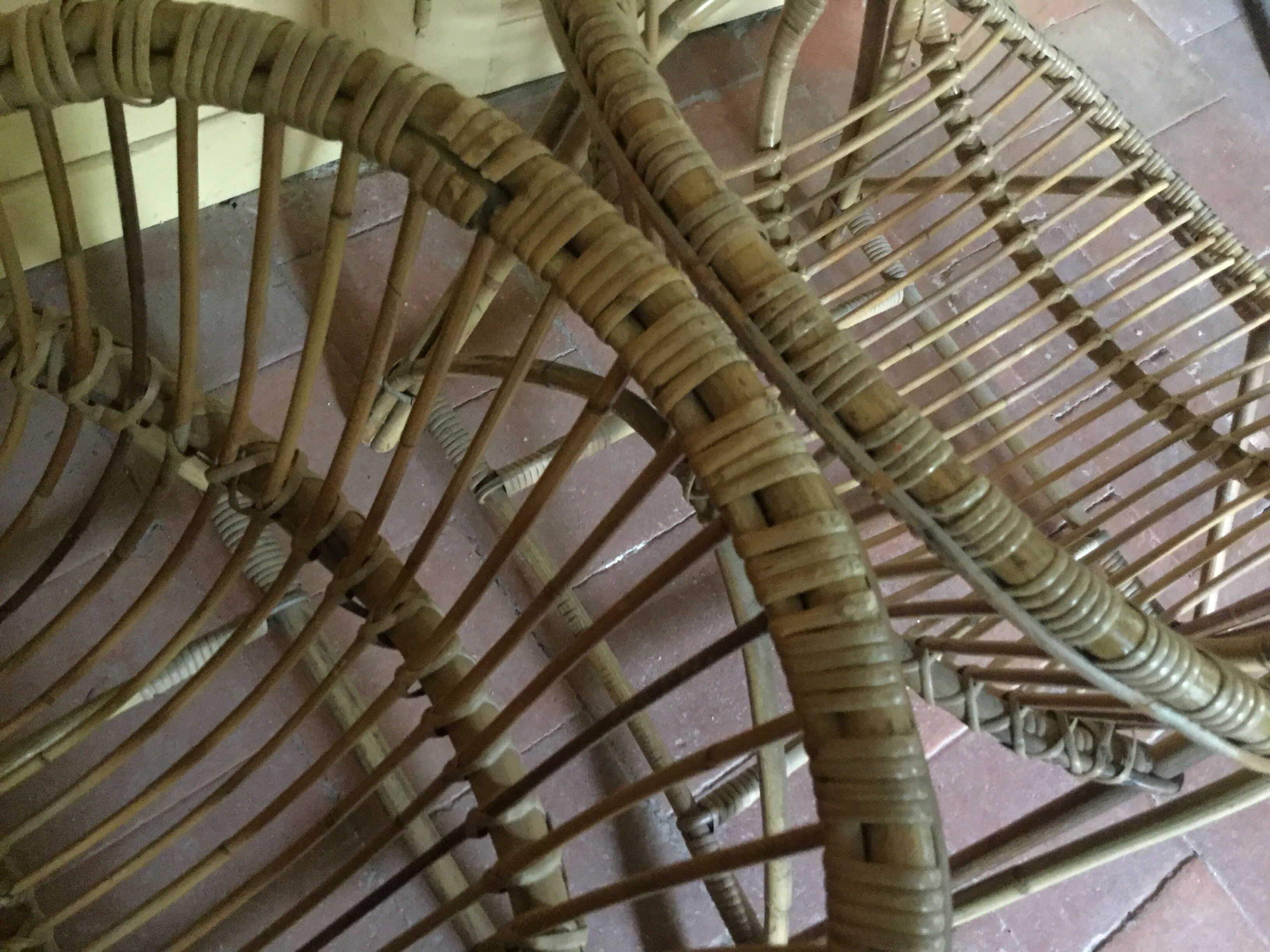 A pair of rattan armchairs