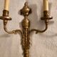 Pair of Louis XVI style neoclassical wall sconces in gilt bronze