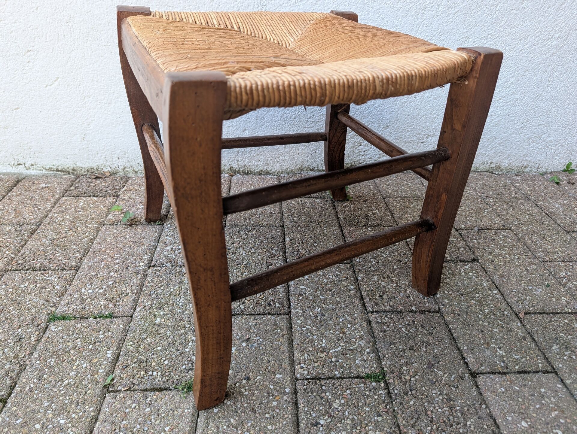 Antique solid wood stool with traditional rush seating – Late 19th century