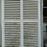 Wooden persian shutter with an opening