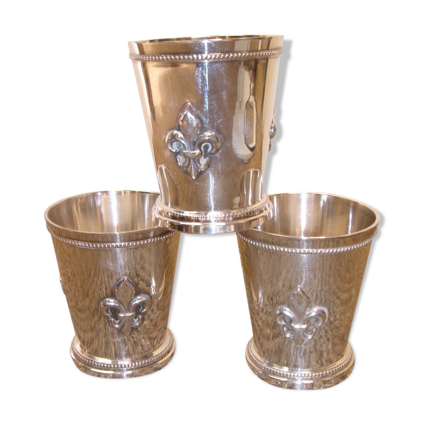 3 silver cups, lily flower
