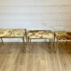 Set of 3 vintage nesting tables in onyx and gold metal from the 1970s.