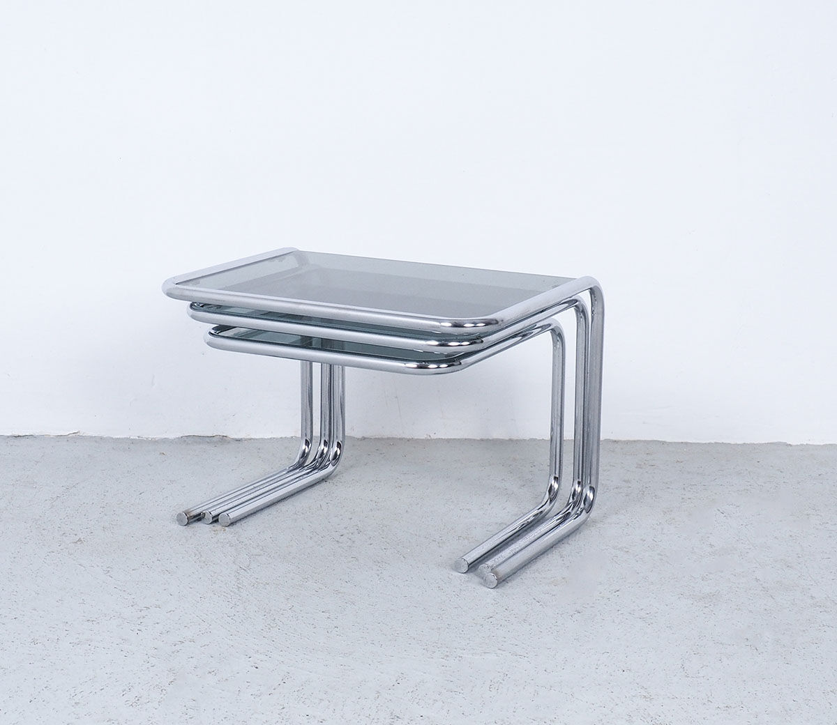 Vintage chromed nesting tables with smoked glass