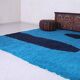 Handmade artisan rug in beige, size 150x250 cm.