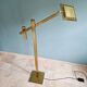 Brass articulated chandelier with counterweight, Hollywood Regency style, 1970-80.