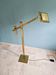 Brass articulated chandelier with counterweight, Hollywood Regency style, 1970-80.