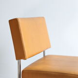 Modernist armchair in chromed metal and imitation leather, 50s/60s