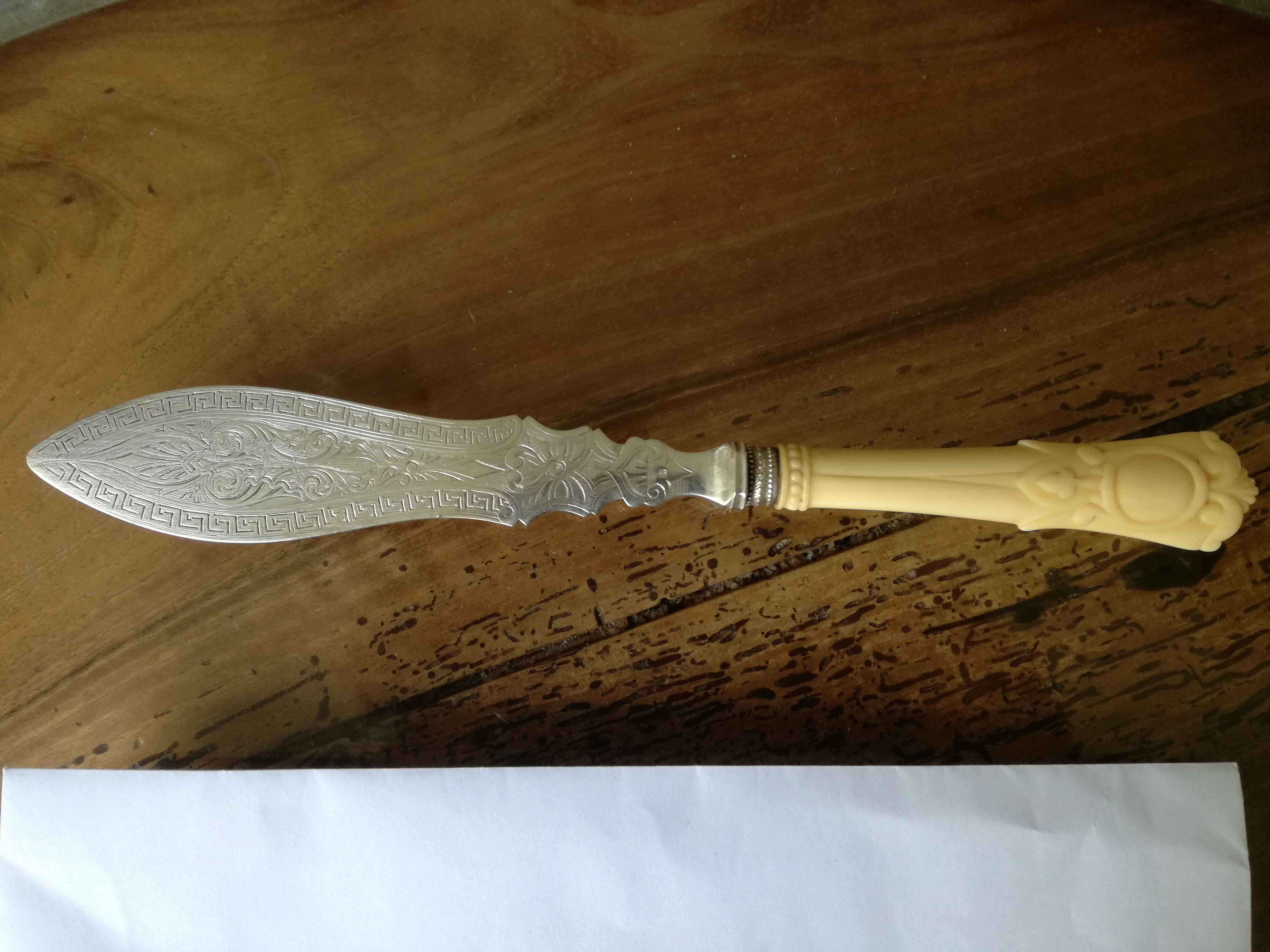 Silver and ivory paper cut