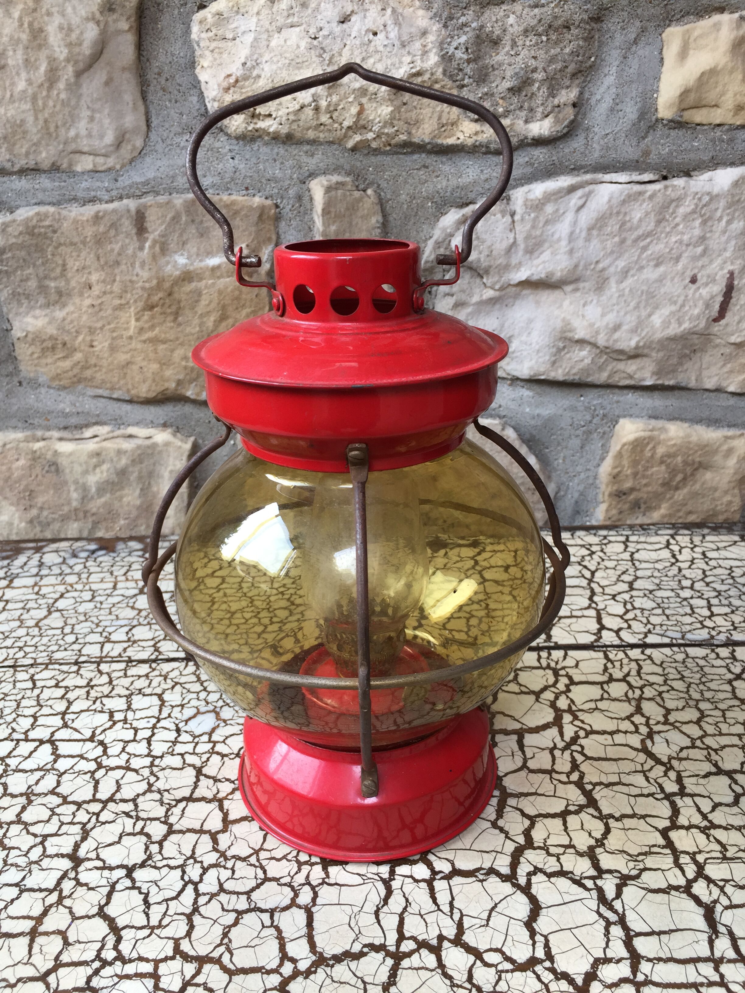 Vintage round glass and metal storm lamp