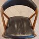 Set of 6 vintage Kai Kristiansen chairs in solid teak and black faux leather.