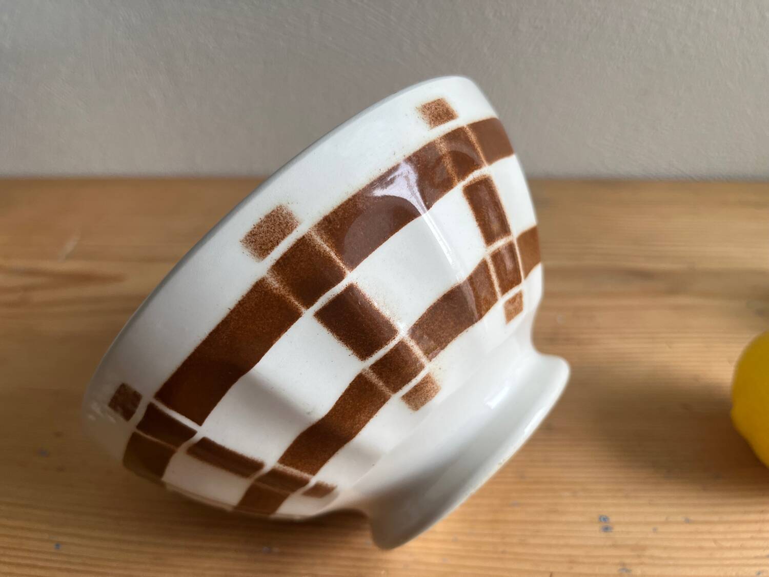 Antique faceted bowl on earthenware pedestal