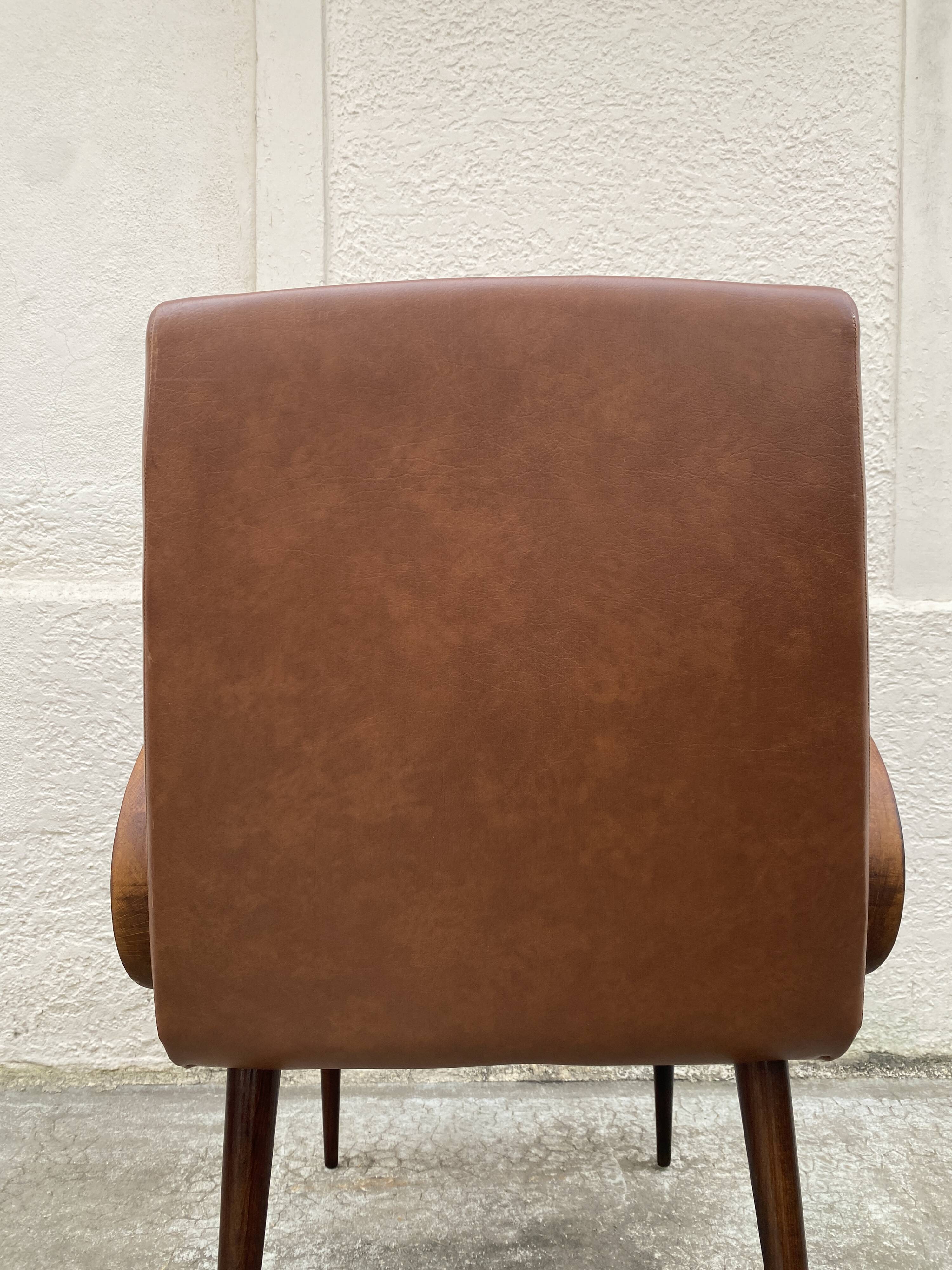 Mid-Century Scandinavian vintage retro armchair with oval armrests.