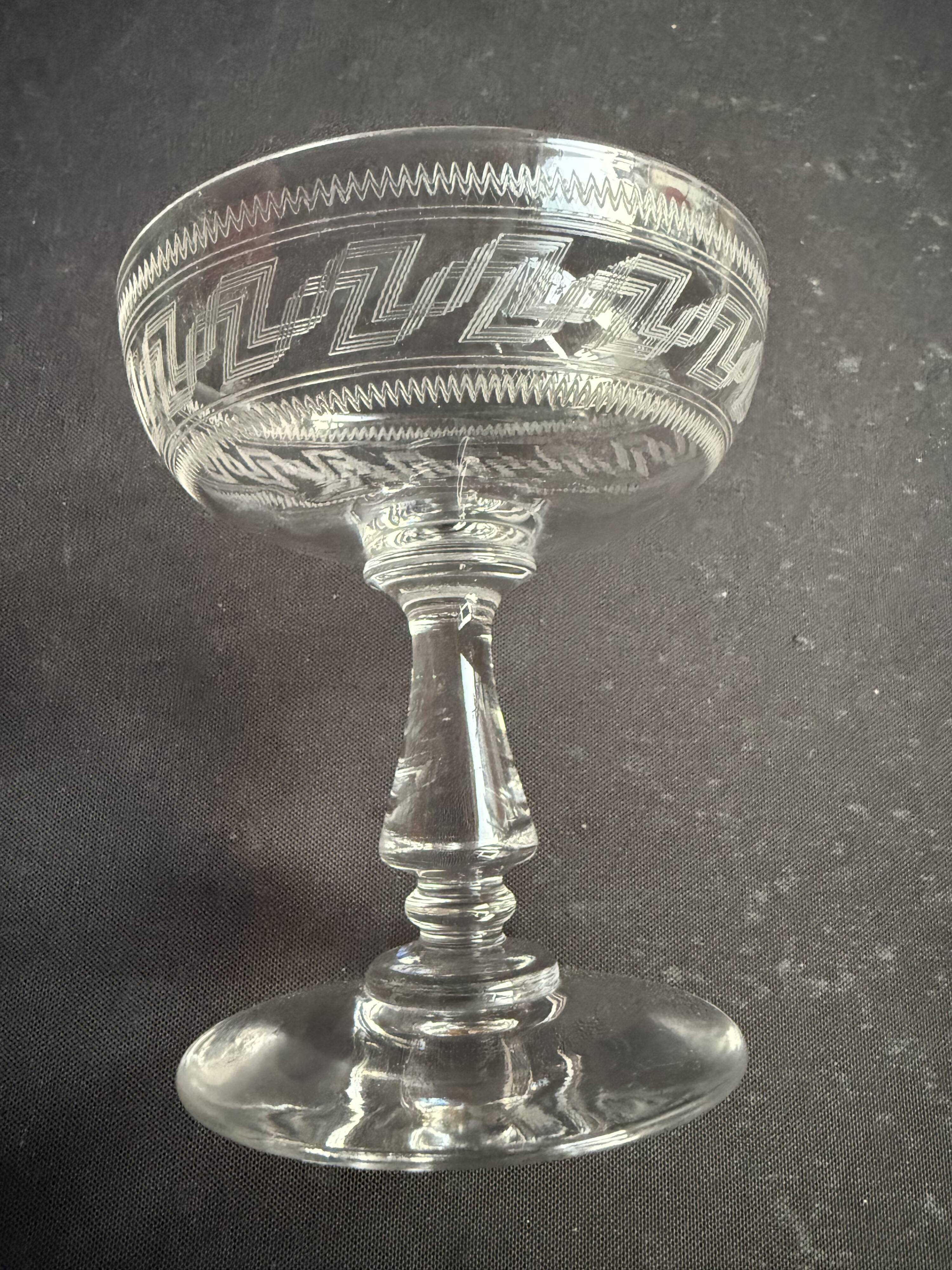 6 Baccarat champagne coupes with Greek engraving, slanted.