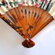 Vintage bamboo fan with floral decoration from China.