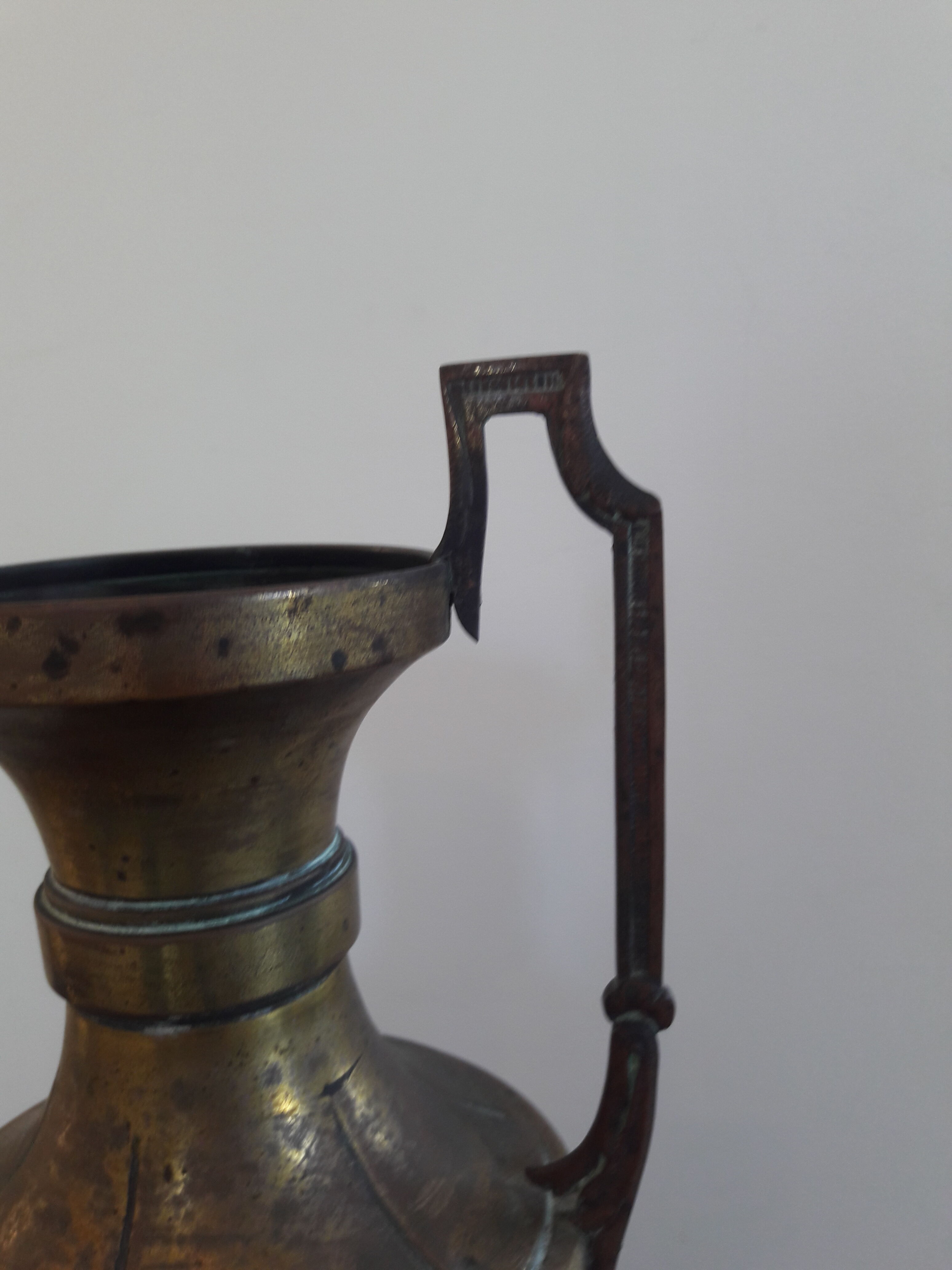 Brass amphora vase - copper art deco style on pedestal with floral pattern handles